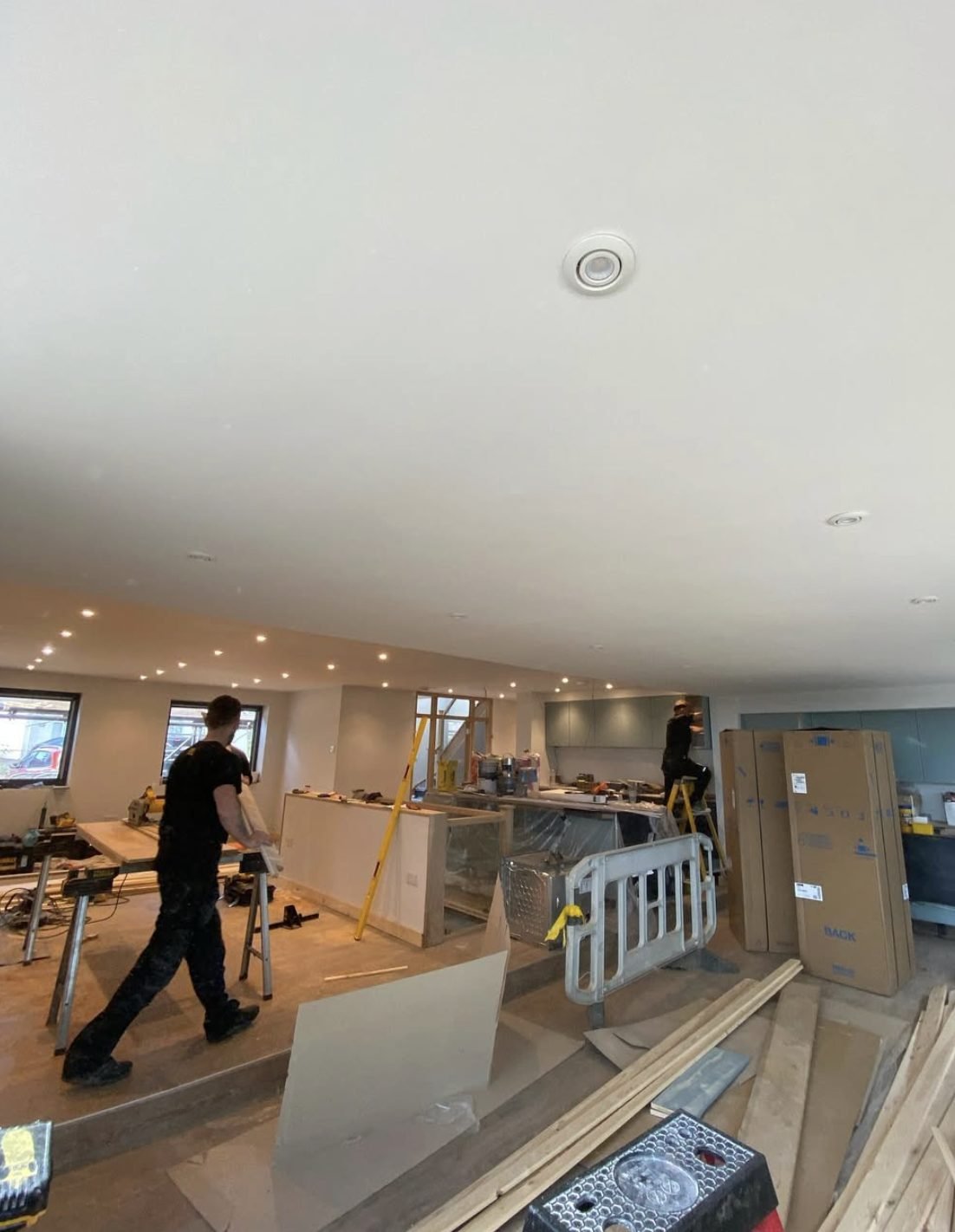 Recessed downlights across an open plan kitchen living space